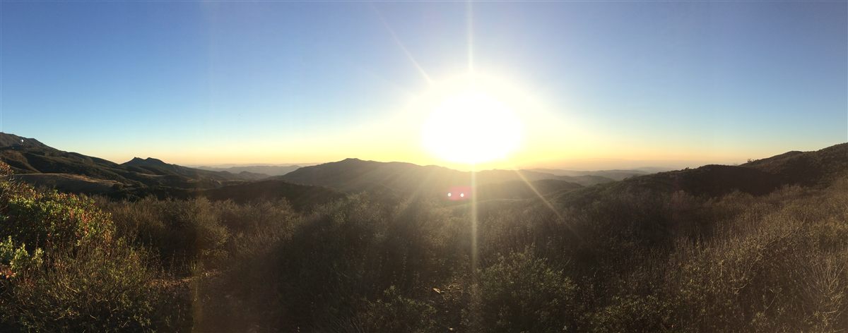 Sunrise over the Santa Ana Mountains above Corona, California — panoramic view of the hills and open sky