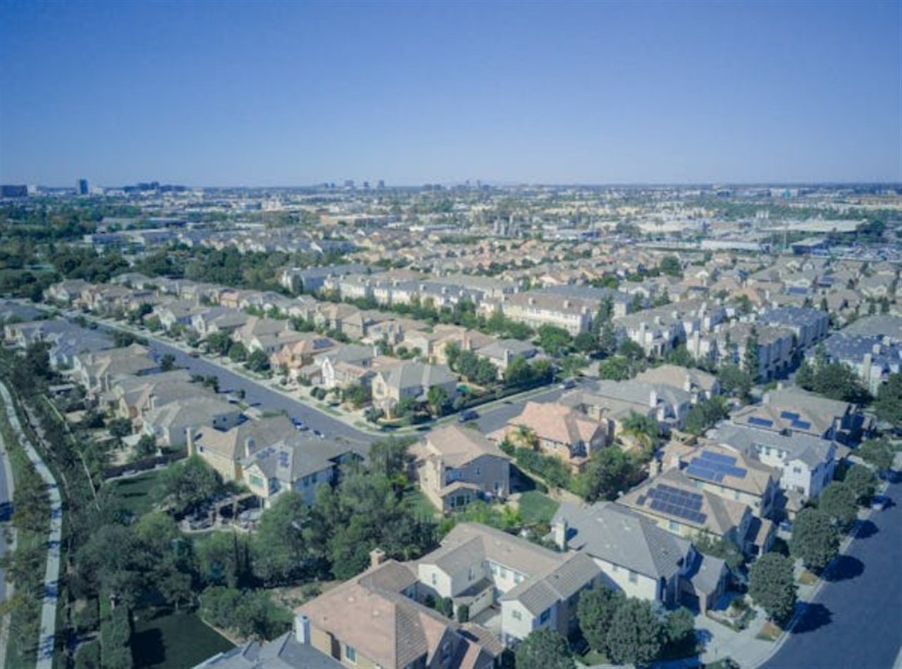 Aerial view of Irvine master-planned community with solar panels on rooftops