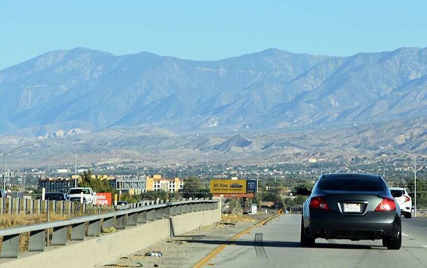 State Route 14 approaching Lancaster, California with San Gabriel Mountains in the background